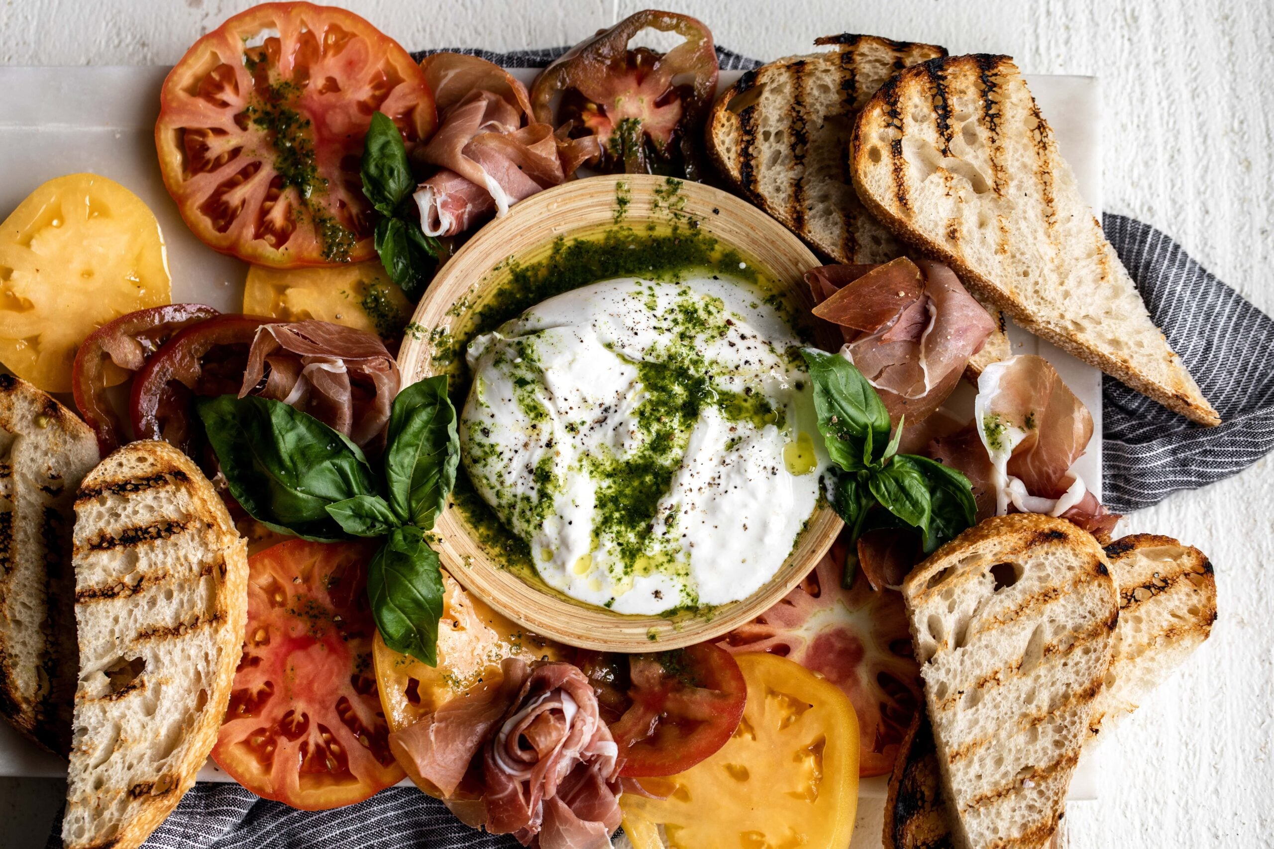 Burrata with Heirloom Tomatoes and Basil Oil